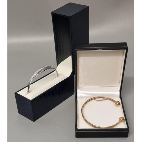 308 - 9ct gold torque bangle.  5.5g approx.  Together with another 9ct white gold stone set hinged bangle.... 