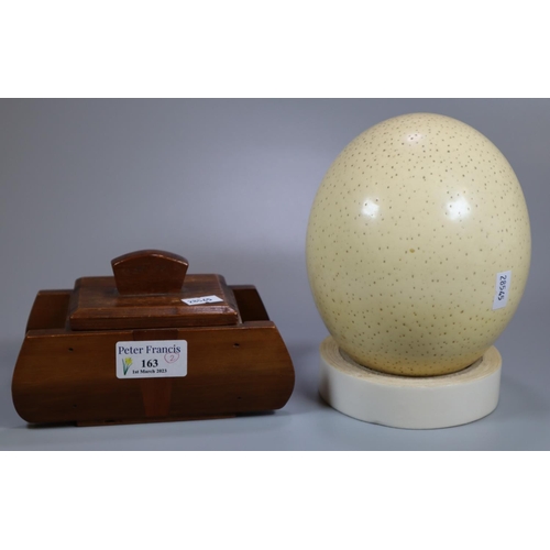 163 - Large Ostrich egg, together with a wooden lidded box in the form of a stylised tank.  (B.P. 21% + VA... 