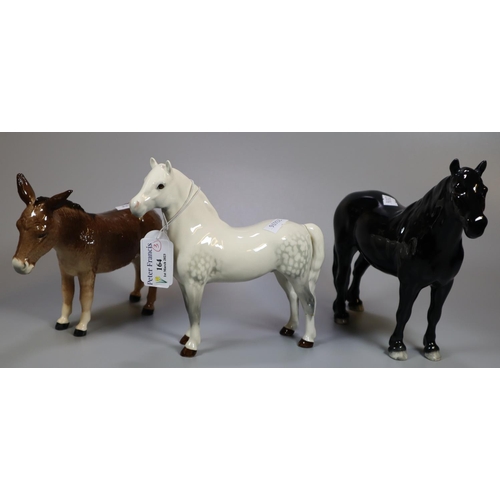 164 - Three Beswick animal figures; a black Fell pony, a dapple grey Welsh Mountain pony and a donkey. (3)... 