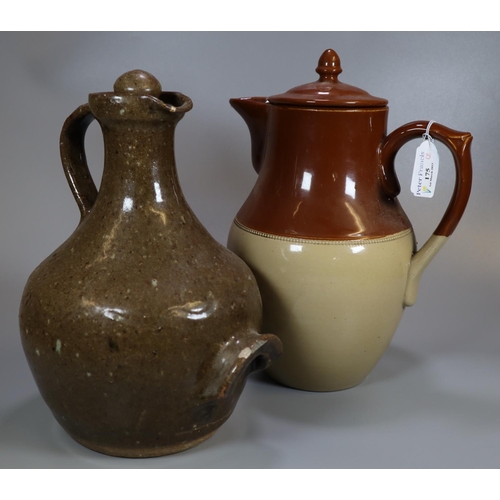 175 - Two stoneware jugs or pitchers; one lidded two tone tea or coffee jug and a wine jar with stopper an... 