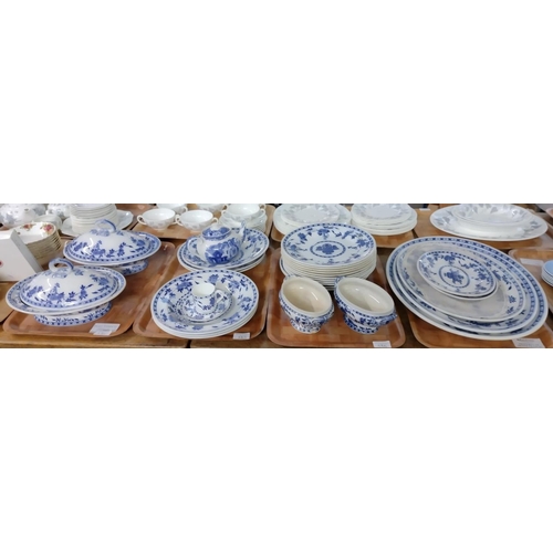 335 - Four trays of blue and white Mintons 'Delft' pattern dinnerware, to include: oval meat plates, shall... 