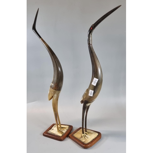 45 - A pair of horn studies of cranes on wooden bases. 42cm high approx. (2)
(B.P. 21% + VAT)