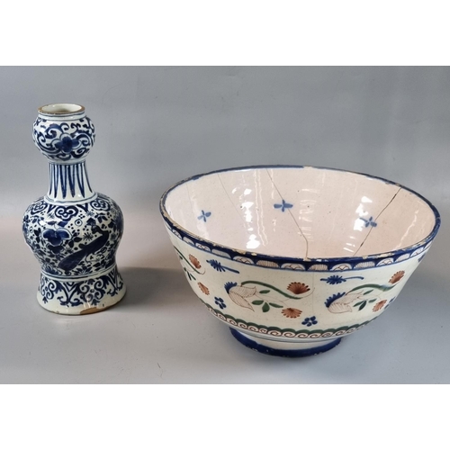 46 - 19th Century Delft pottery bowl with floral and stylised decoration. 26cm diameter approx. Together ... 