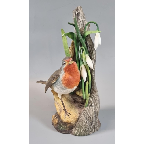 8 - A Boehm porcelain study, robin with snowdrops. Printed marks to base. 20cm high approx. 
(B.P. 21% +... 