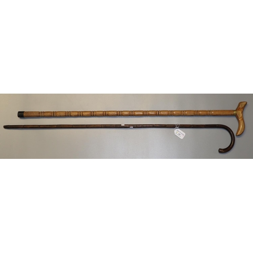 187 - Malacca cane walking stick and a modern hardwood walking stick.  (2)   (B.P. 21% + VAT)