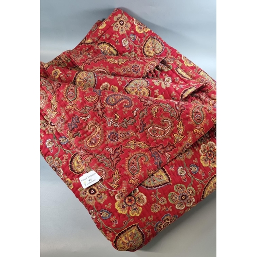 97 - Vintage red ground reversible paisley and floral and foliate printed quilt or bedspread. 
(B.P. 21% ... 