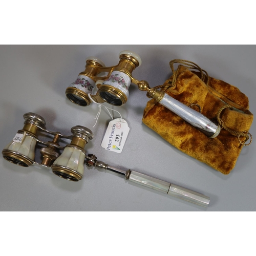 293 - Two pairs of French opera glasses, one mother of pearl finish, the other with floral enamel finish. ... 