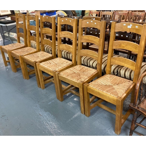 473 - Set of six robust pine ladder back dining chairs with seagrass seats.  (6)  (B.P. 21% + VAT)