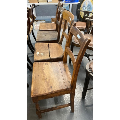 477 - Four 19th century Welsh bar back oak kitchen chairs, one with overhanging top rail, solid seats.  (4... 