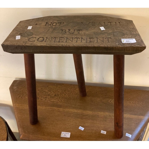 522 - Rustic elm and stained stool with the motto carved 'Not Wealth but Contentment'.  (B.P. 21% + VAT)