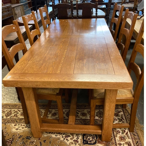 525 - Good quality solid oak farmhouse kitchen cleated plank top table on chamfered legs together with a s... 