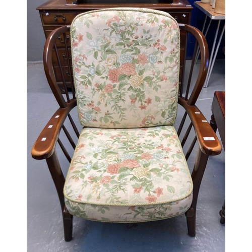 541 - Ercol style stained beech stick backed armchair with loose floral cushions.  (B.P. 21% + VAT)