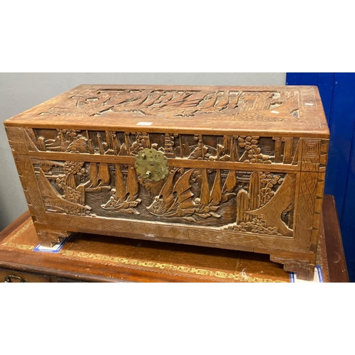 542 - Chinese heavily carved camphor wood box decorated with sailing vessels.  88cm wide approx.  (B.P. 21... 