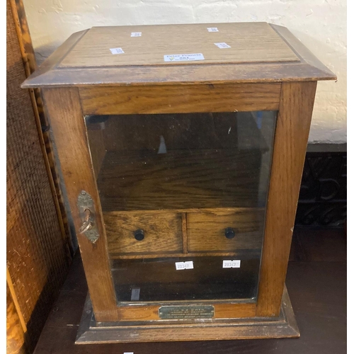 561 - Early 20th century oak smoker's cabinet with fitted interior and glass door. (B.P. 21% + VAT)