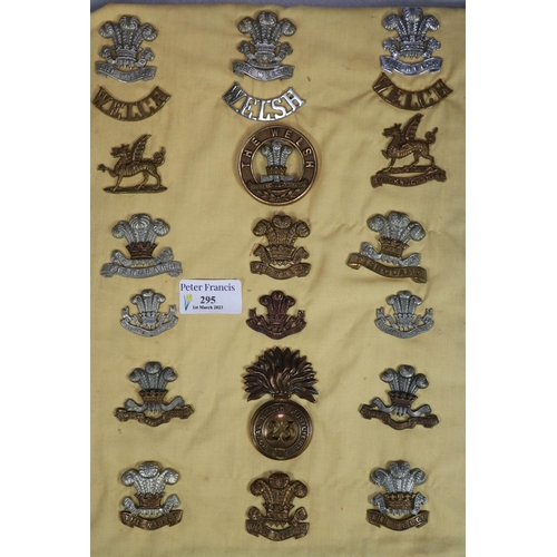 295 - Collection of Welsh British military cap badges including: Brecknockshire, The Welsh, Fishguard, The...