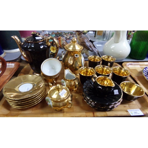 362 - Tray of lustre coffee ware to include: Wade England black glazed part coffee set; coffee cups and sa... 