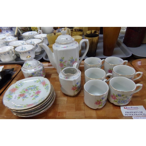 368 - Tray of Japanese coffee ware decorated with pastel coloured flowers on a white ground with gilt edgi... 