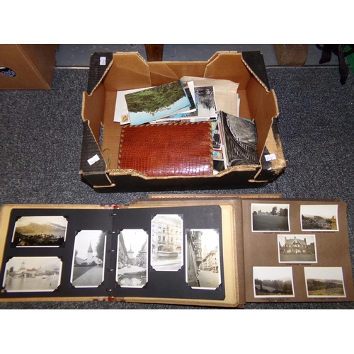 384 - Box containing wooden cribbage board, two photograph albums with black and white photographs, one da... 