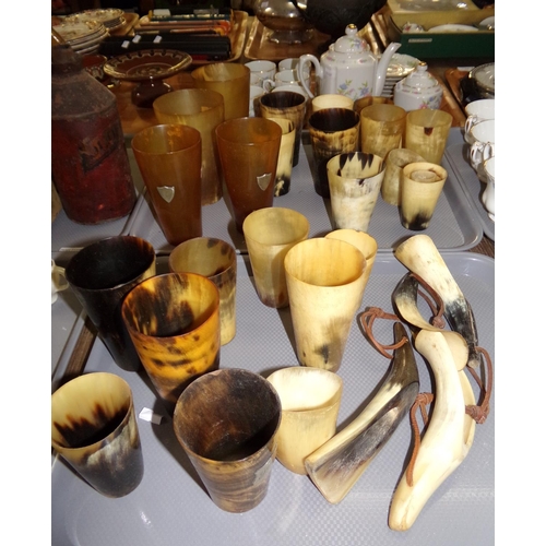 398 - Two trays of vintage and antique horn beakers, two with silver mounts, together with four horn shoe ... 