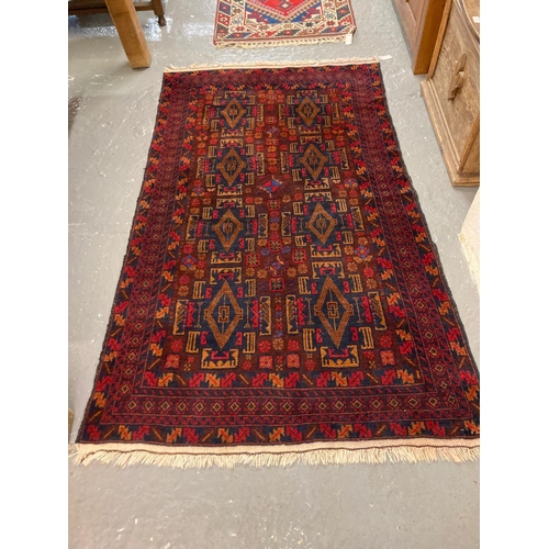 594 - Hank knotted Zanjan style Persian runner on a red ground with geometric designs and lozenge medallio... 