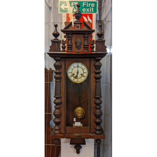 442 - Early 20th century walnut two train presentation Vienna type wall clock, with key and pendulum.  (B.... 