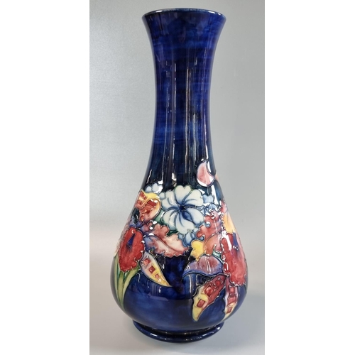 146 - Moorcroft Art Pottery tube lined 'Orchid' vase of tapering mallet form. 30cm high approx, with impre... 