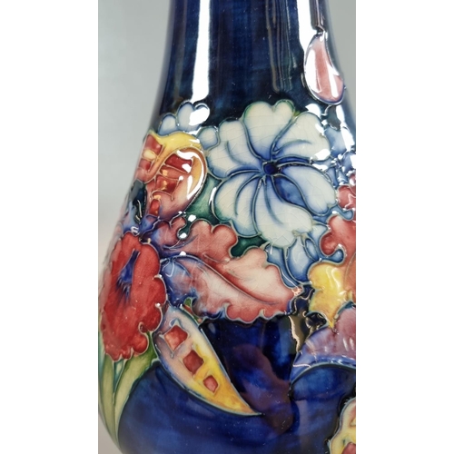 146 - Moorcroft Art Pottery tube lined 'Orchid' vase of tapering mallet form. 30cm high approx, with impre... 