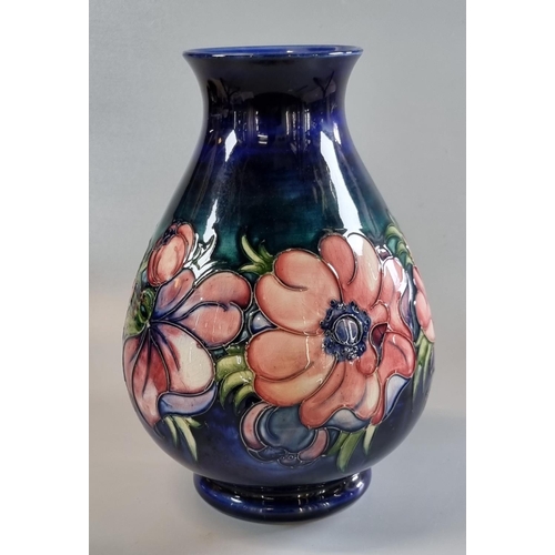 148 - Moorcroft Art Pottery tube lined 'Anemone' pattern vase, of baluster tapering form.  25cm high appro... 