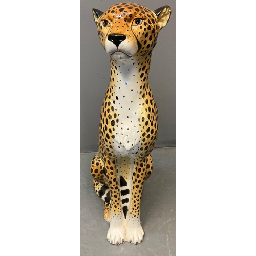 155 - Modern ceramic handpainted study of a cheetah with naturalistic features, in seated pose.  Probably ... 