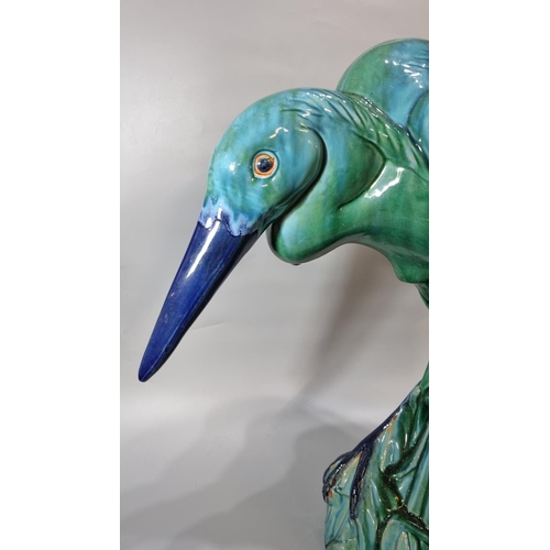 156 - Unusual Majolica pottery study of a Heron in a natural setting of reeds, in stooped pose.  67cm high... 