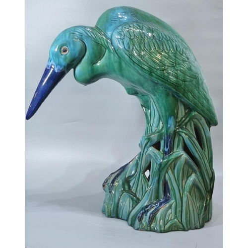 156 - Unusual Majolica pottery study of a Heron in a natural setting of reeds, in stooped pose.  67cm high... 