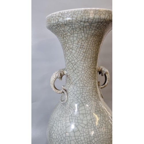 160 - Large Chinese celadon stoneware baluster vase on a crackle glaze ground with elephant mask ring hand... 