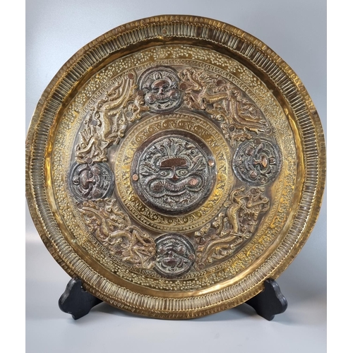 174 - 19th/20th century Indo Tibetan copper, brass and white metal circular tray with hammered and applied... 