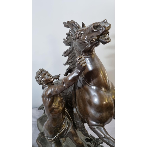 177 - After Guillaume Coustou (1677-1746), bronze Marley Horse with Groom, on a naturalistic base.  56cm h... 