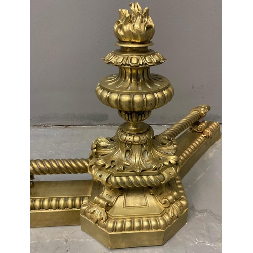 189 - 19th century rococo style yellow metal fire fender with two urn shaped capitals, flambe mount and ro... 