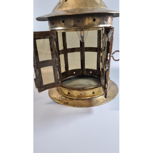 191 - Arts and Crafts design brass hall lantern, the fluted gallery above circular brass and glass panels,... 