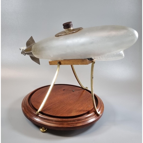 192 - Unusual novelty glass and metal decanter in the form of a stylised Zeppelin airship with miniature t... 