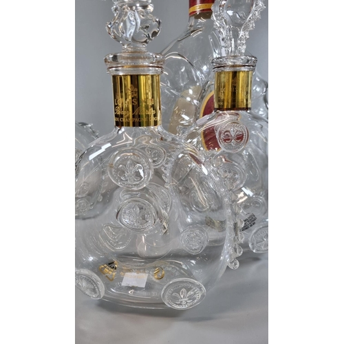 197 - Five similar Remy Martin Baccarat glass cognac decanters and stoppers, together with a larger fine c... 