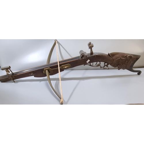 228 - 19th century, probably Swiss, target crossbow, having steel bow, heavily carved hardwood full stock,... 