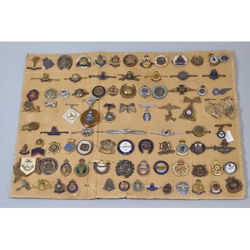 243 - Large collection of British military sweetheart brooches of different forms: WWI and WWII, 95 approx... 