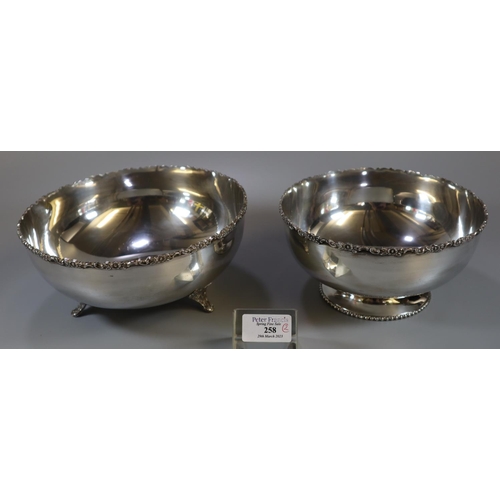 258 - Two Indian silver bowls, both similarly decorated with flowers and foliage to the rims, both marked ... 