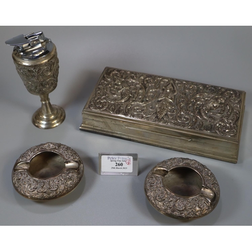 260 - Collection of Thai silver items, to include: cigar box, pair of ash trays and a table lighter marked... 