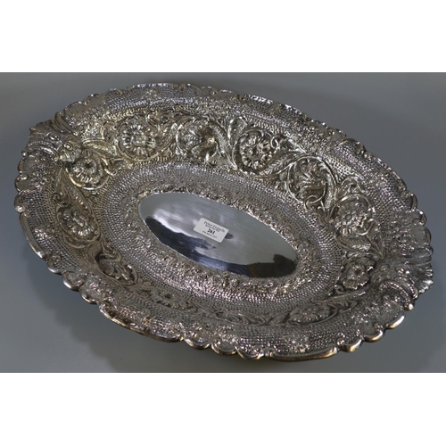 261 - Impressive Indian silver bowl, of oval form ornately embossed and decorated with flowerheads, scroll... 