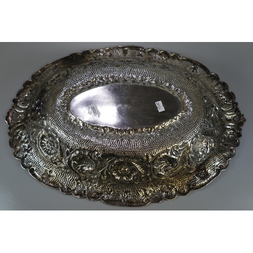 261 - Impressive Indian silver bowl, of oval form ornately embossed and decorated with flowerheads, scroll... 