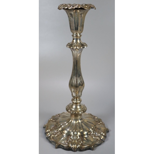 264 - Pair of mid Victorian silver candlesticks, having shaped circular loaded bases with shell decoration... 