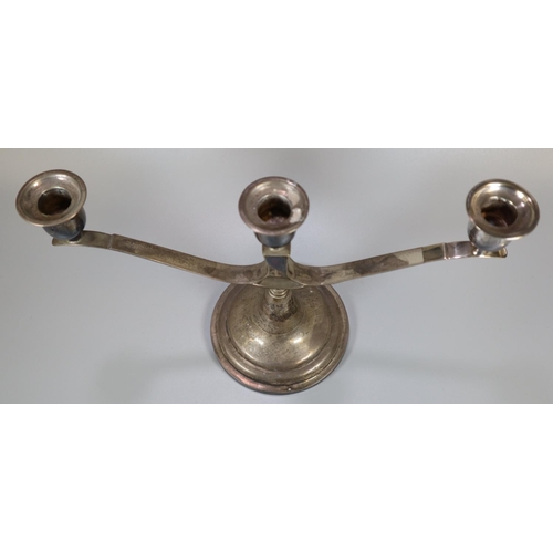 266 - Waikee, Hong Kong, silver three branch candelabra on a circular stepped base.  19.5cm high approx.  ... 