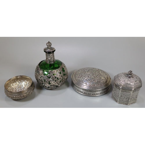 276 - Collection of Indian white metal dressing table items, to include: circular box and cover decorated ... 