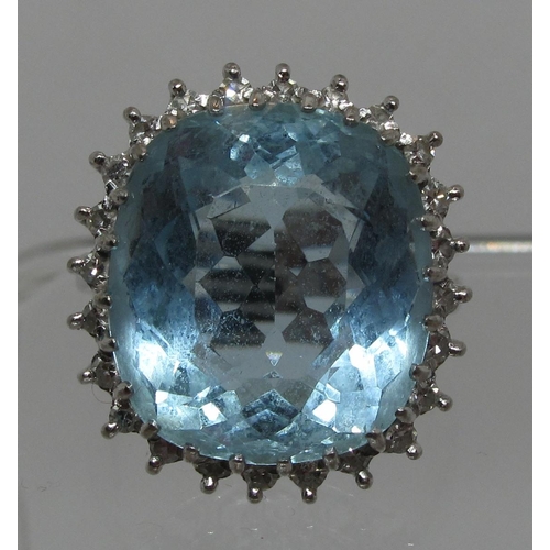 279 - Aquamarine and diamond ring set in 18ct white gold.  Aquamarine approx 16 x 14mm surrounded by twent... 