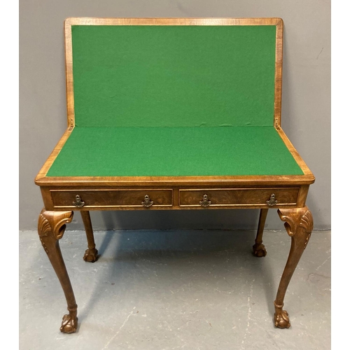 28 - Georgian style walnut fold over card table, the moulded top with hinged lid and green baize above tw... 