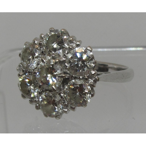 280 - Large diamond cluster ring set in 18ct white gold.  The brilliant cut diamonds an estimated total di... 